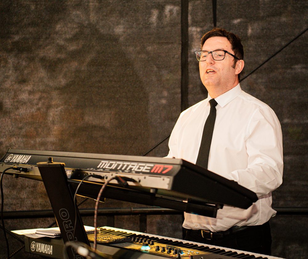 Jamie singing at the keys
