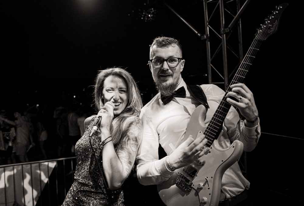 Keely-Marie and Lanni on stage in black and white